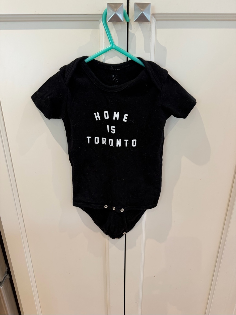 Peace collective 18m Black "Home Is Toronto" Baby Onesie
